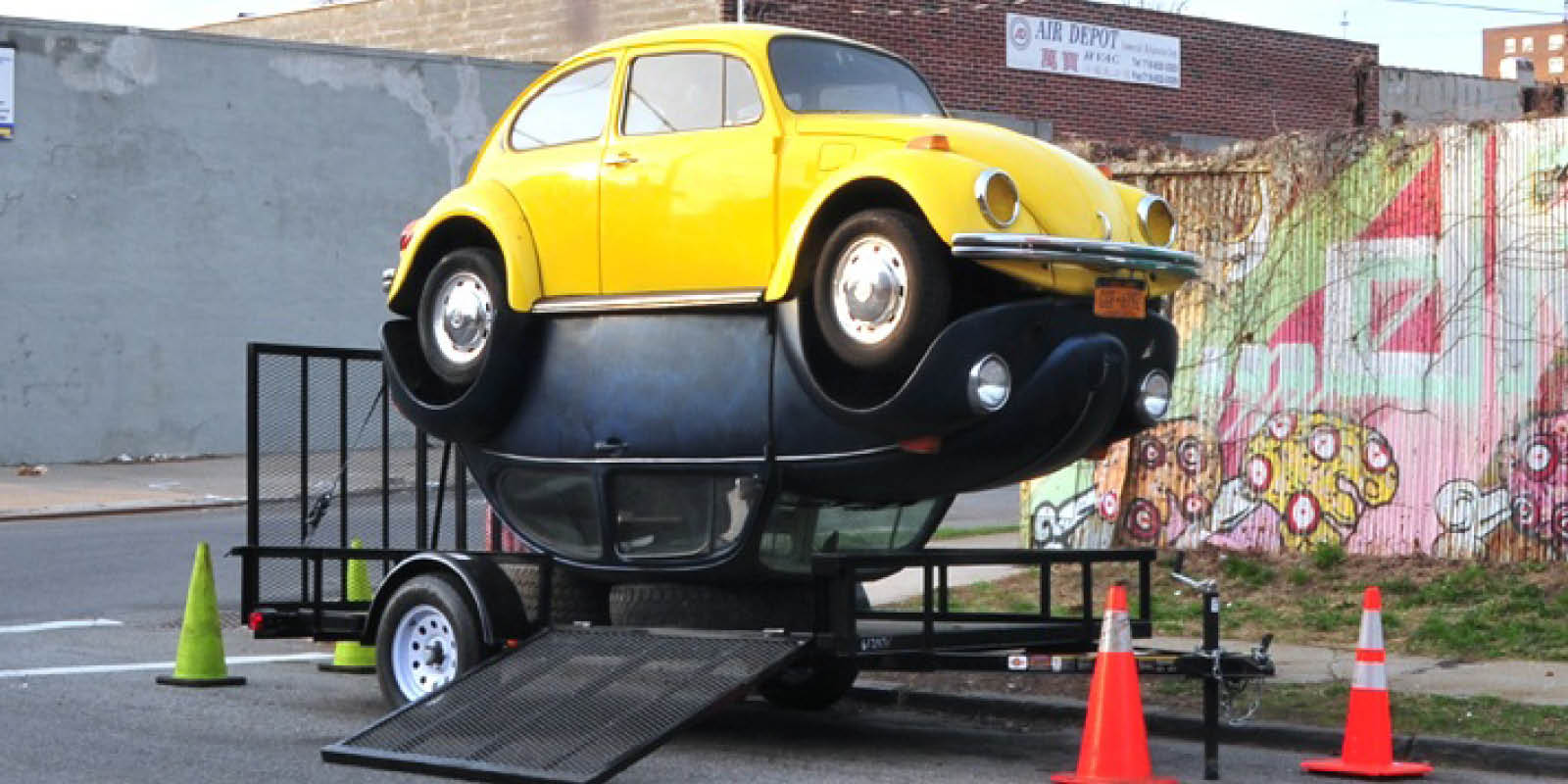 Beetles, a sculpture by Maximiliano Siñani made of two 1972 & 1974 Volkswagen Beetles connected by their four wheels