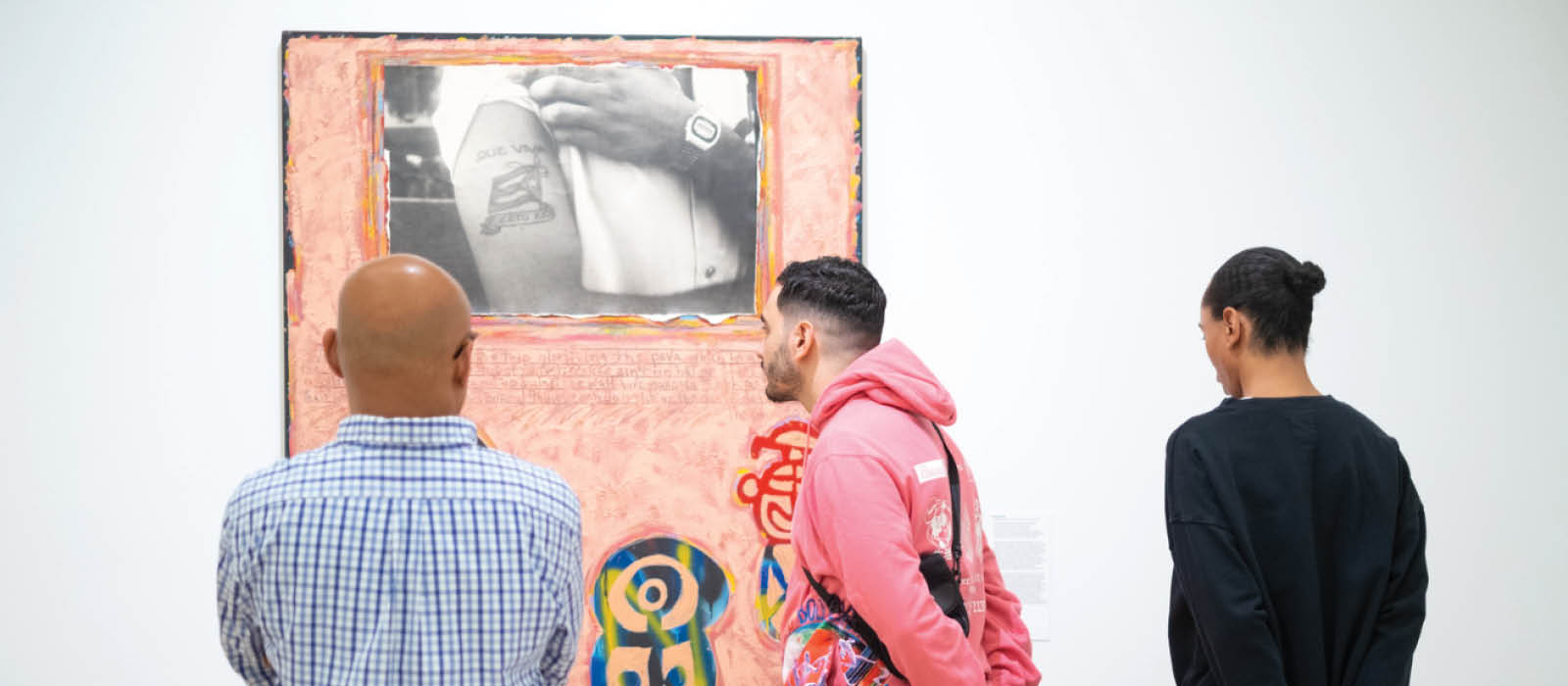 People visiting El Museo's exhibition