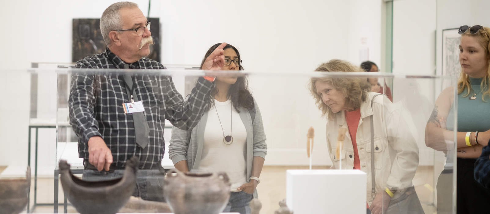 People visiting El Museo's exhibition