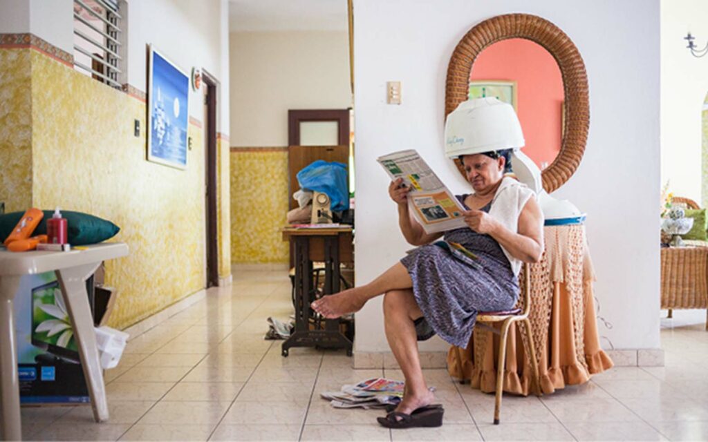 photo of woman in hairdryer