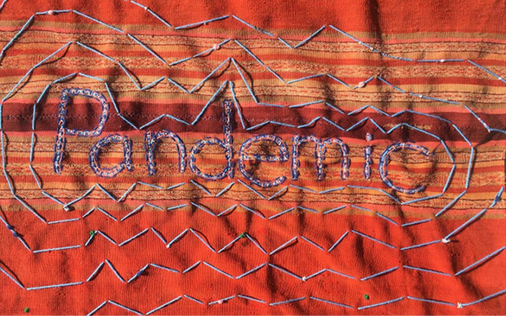 handmade weaving with the word "Pandemic"