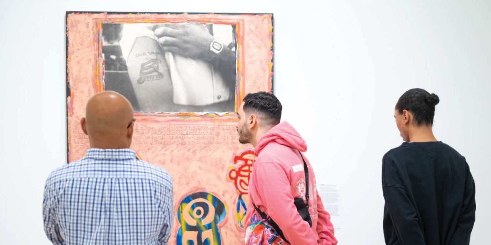 People visiting El Museo's exhibition