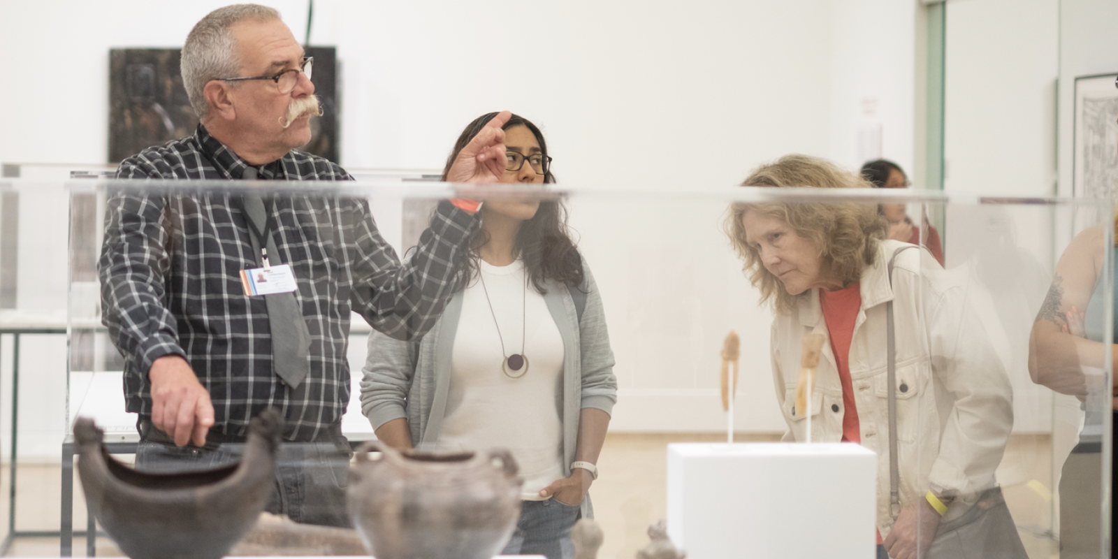 People visiting El Museo's exhibition
